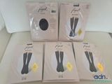 four pairs of women ' s knee high socks in packaging