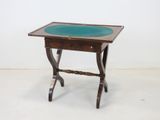 an image of a small table with a glass top on a white floor