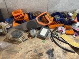 a pile of assorted items on the floor next to a wall