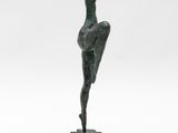 a bronze statue of a woman on a black base