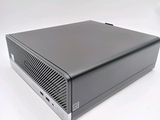 an image of a black computer on a white surface