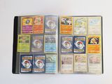 a lot of pokemon cards in a binder