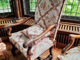 a chair that is sitting in front of a window