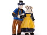 a figurine of a man and a woman standing next to each other