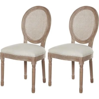 une paire de chaises en bois avec des coussins rembourrés blancs