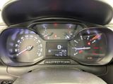 a close up of a car dashboard with a speedometer and a steering wheel