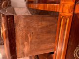 a close up of a wooden cabinet with a drawer