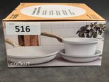 packaging of a set of two white bowls and a saucer with a wooden handle