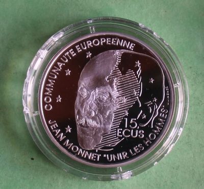 a close up of a coin with a skull on it