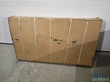 a cardboard box sitting on the floor in front of a garage door