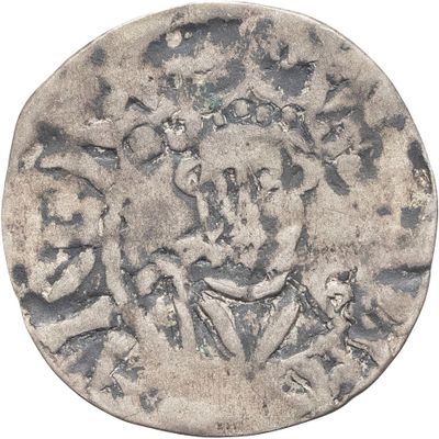 une vieille pièce d'argent sur laquelle figure le portrait d'un homme