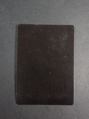 a close up of a piece of black paper on a table
