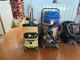 many different vacuums and other cleaning equipment on the floor