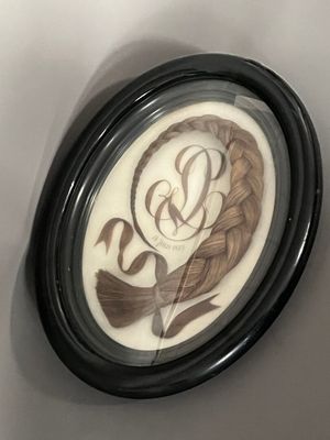 a picture of a clock with a picture of a woman on it