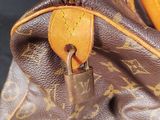 a close up of a purse with a padlock on it