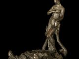 bronze statue of a man holding a fish on top of a rock
