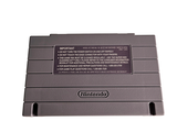 a nintendo game console sitting on top of a white surface