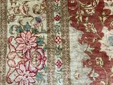an image of a close up of a rug with a cat laying on it