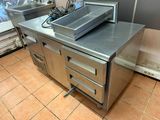 a kitchen with a sink and a microwave on the counter