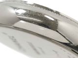 a close up of a silver watch with a white background