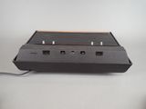 an old style video game console sitting on top of a table