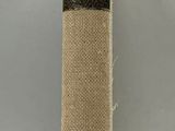beige burlock cloth with black stripe on a white background