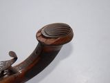 a close up of a pipe with a bird on it