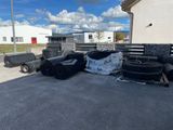 a lot of tires that are sitting on the ground