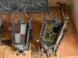 three different colored stained glass hanging on the wall