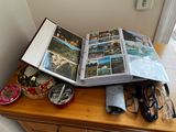 a table with a book, glasses, and other items on it