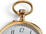 a close up of a gold pocket watch on a white background