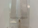 a lamp that is sitting on a glass table