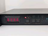 a close up of a digital clock on top of a table
