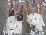 three bags of luggage with tags attached to them