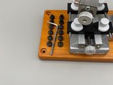 a microscope that is sitting on top of a piece of wood