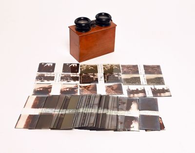 a wooden box that has a bunch of photos on it