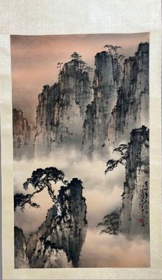 chinese painting of mountains and clouds in the sky above them