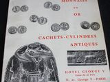 an old book with a bunch of coins on it