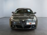 the front view of a grey alfa car in a white room