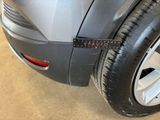a close up of a car with a tape on it ' s side