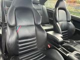 two seats in the back of a car that are black