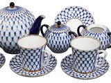 blue and white porcelain tea set with matching cups and saucers