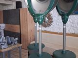 three green blow dryers sitting on top of each other