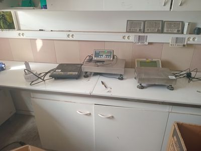 an image of a kitchen with a lot of clutter on the counter