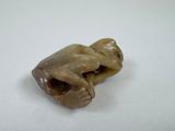 an image of a small figurine on a white surface