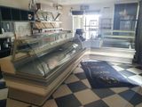 an image of a bakery with a checkered floor and black and white checkered floor
