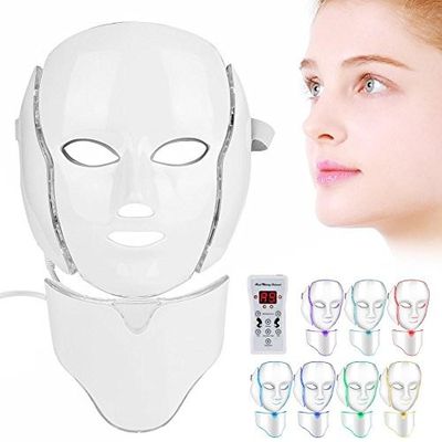 an image of a woman with a face mask and a remote control