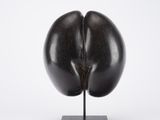 an image of a sculpture of an egg on a stand