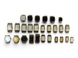 an image of a group of watches sitting on top of a white surface