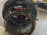 a pile of hoses sitting on the floor in a room